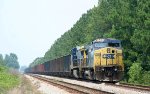 CSX 7685 is on the lead of a rock train in a siding